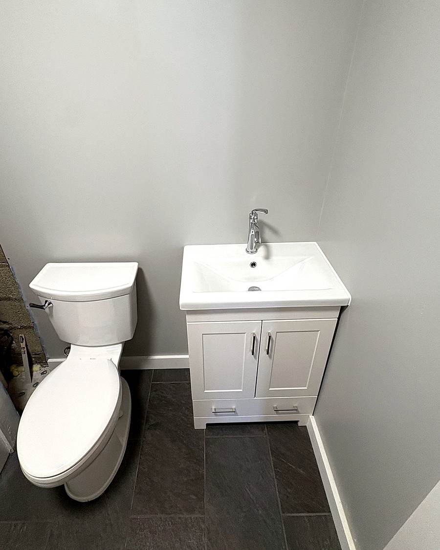 Finished bathroom vanity, sink, and toilet in a Leesburg apartment