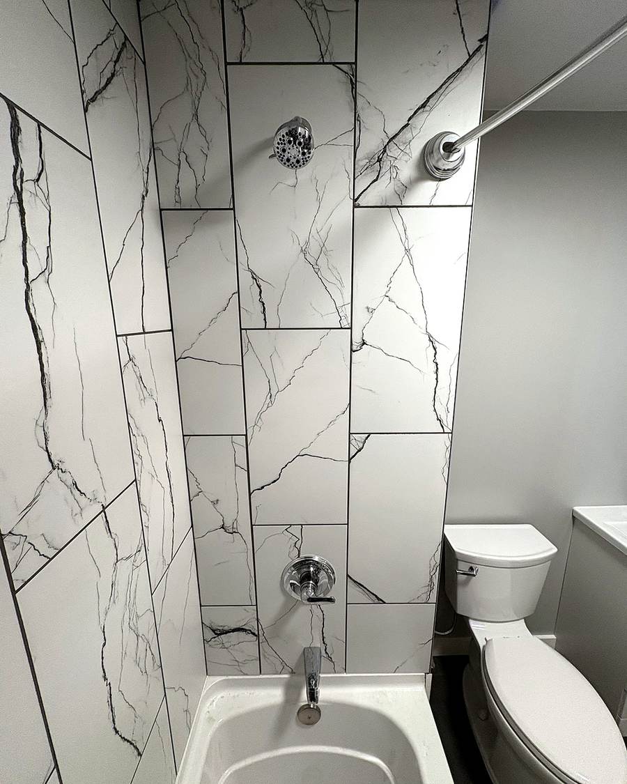 Finished tile tub surround with a shower valve and tub spout in Leesburg