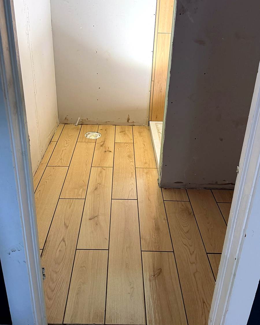 Wood-look plank tile on a bathroom floor